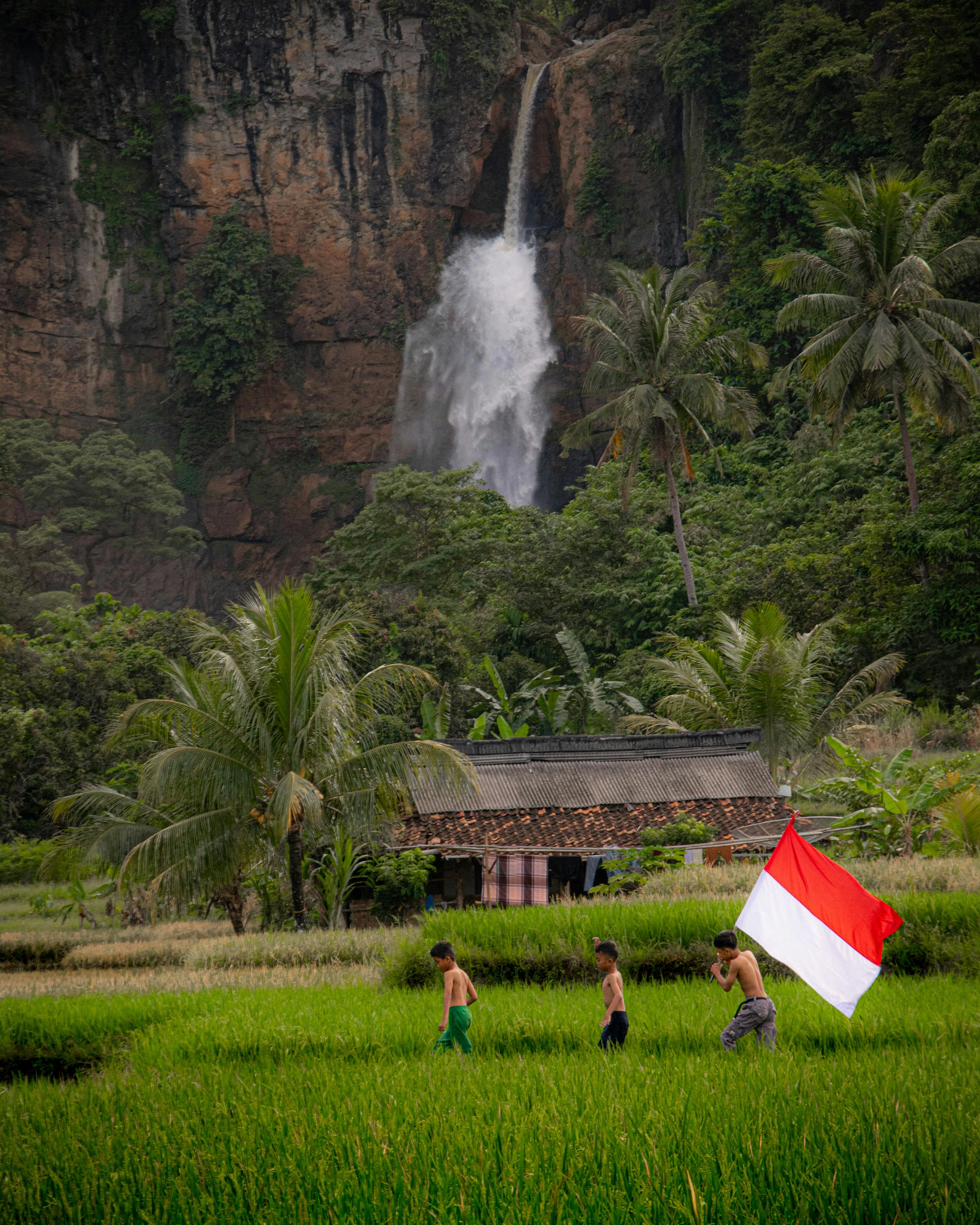 indonesia-flag-bearer-sunset-silhouette